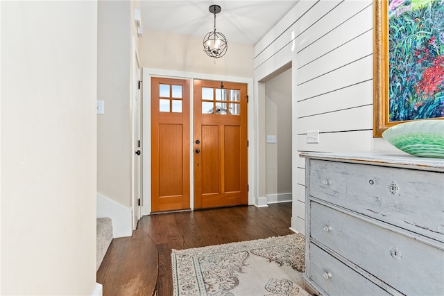 foyer entrance with dark hardwood / wood-style floors