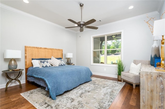 bedroom featuring ceiling fan, dark hardwood / wood-style flooring, and ornamental molding