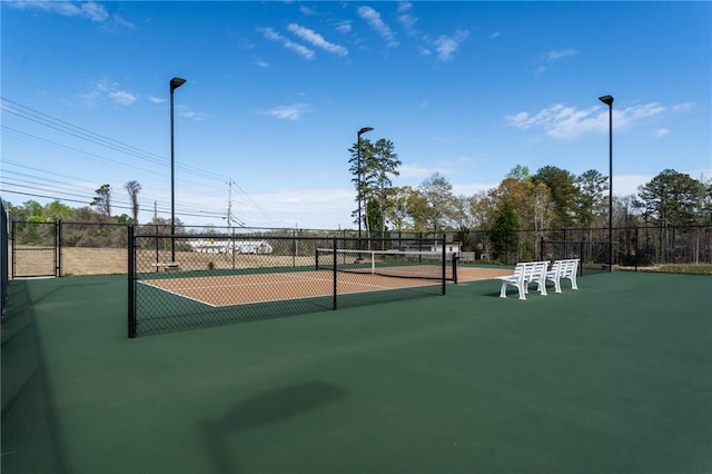 view of community with tennis court