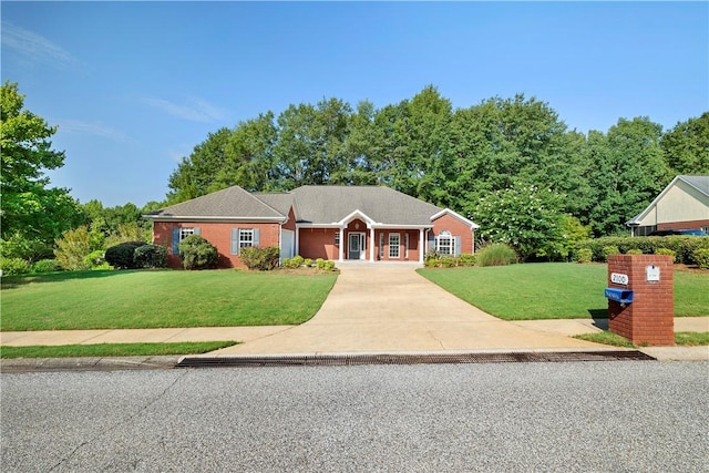 ranch-style house with a front lawn