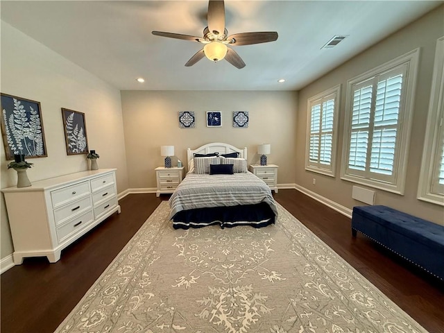 bedroom featuring baseboards, dark wood-type flooring, recessed lighting, and a ceiling fan