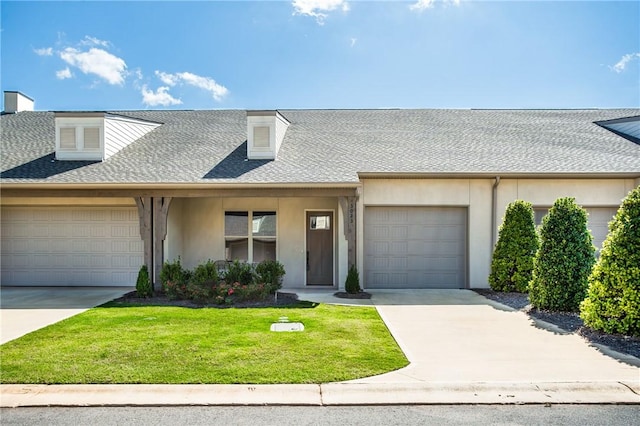 multi unit property featuring an attached garage, stucco siding, concrete driveway, a shingled roof, and a front lawn