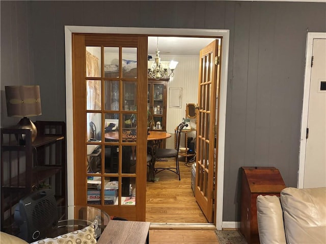 interior space featuring a chandelier and light hardwood / wood-style flooring