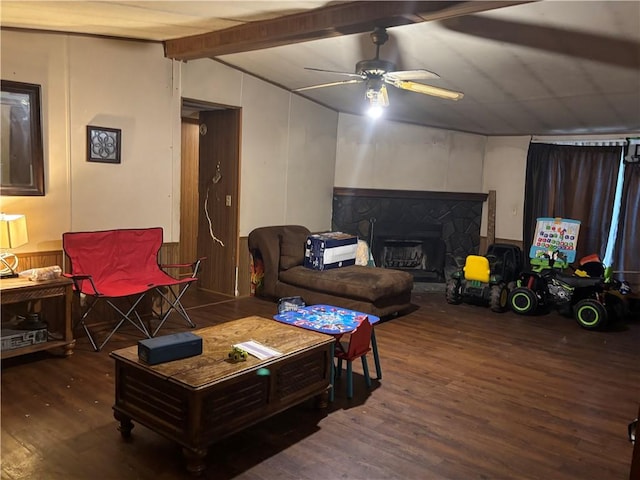 living room with ceiling fan, lofted ceiling with beams, and dark wood-type flooring