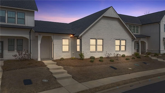 view of front facade featuring a shingled roof