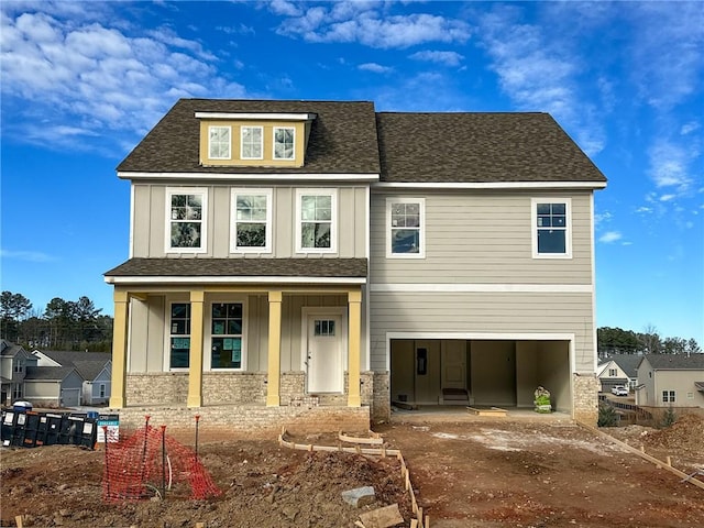 view of front of house with a garage and a porch