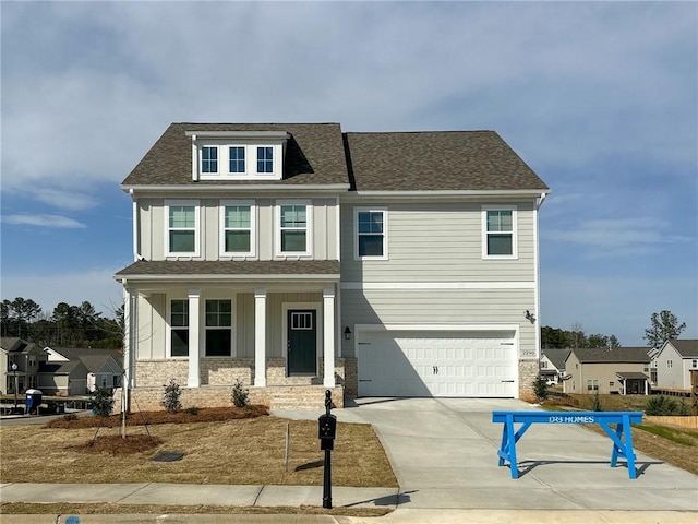 view of front of house with covered porch, roof with shingles, board and batten siding, concrete driveway, and an attached garage