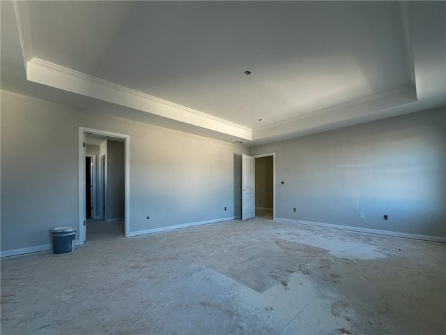 empty room featuring a tray ceiling