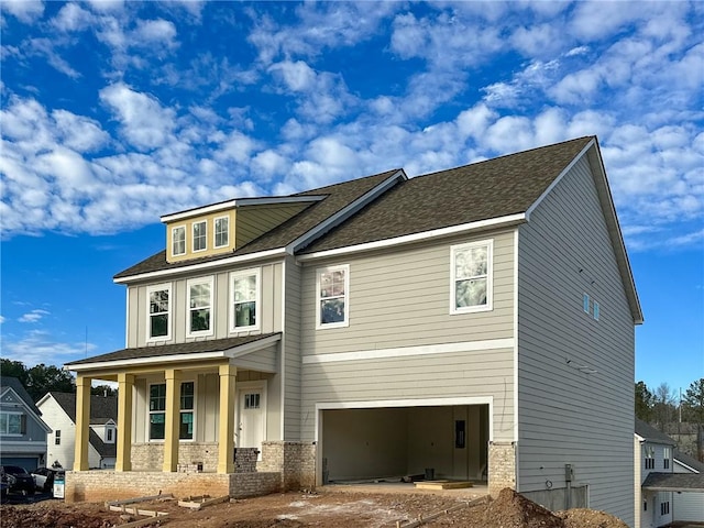 craftsman-style house with a porch and a garage