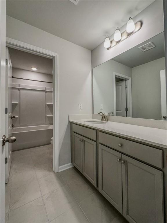 full bath featuring tile patterned flooring, visible vents, toilet, bathing tub / shower combination, and vanity