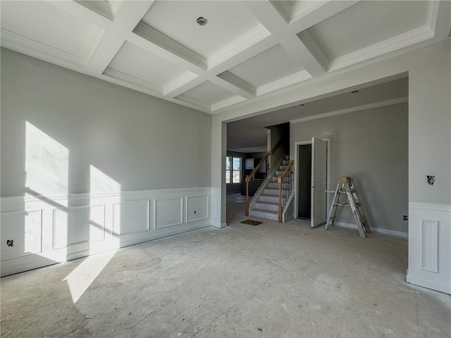 empty room featuring beam ceiling and coffered ceiling