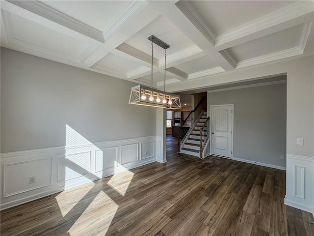 unfurnished dining area featuring dark wood finished floors, beam ceiling, stairway, and coffered ceiling