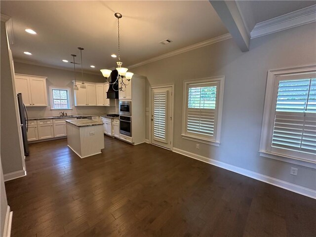 1882 Waterfall Rd, Auburn, AL 36832 - kitchen featuring a sink, ornamental molding, a chandelier, a kitchen island, and freestanding refrigerator