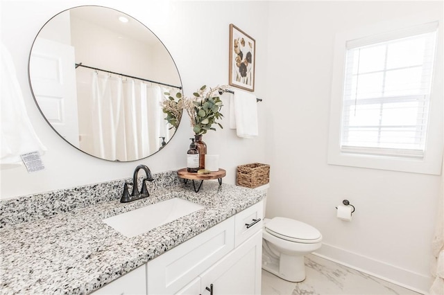 bathroom featuring toilet, a shower with curtain, and vanity