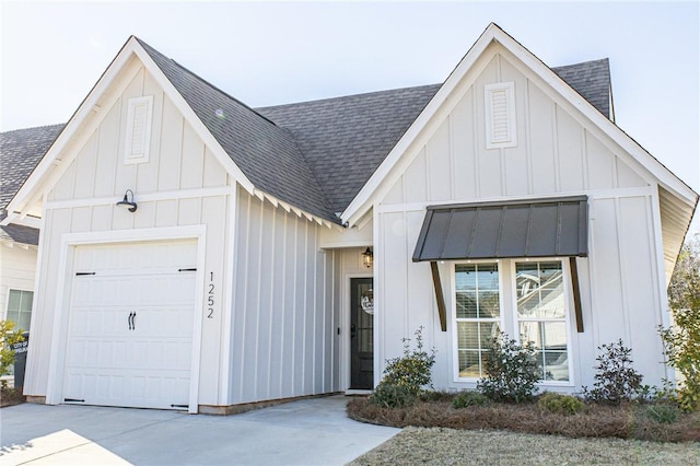 modern farmhouse featuring a garage