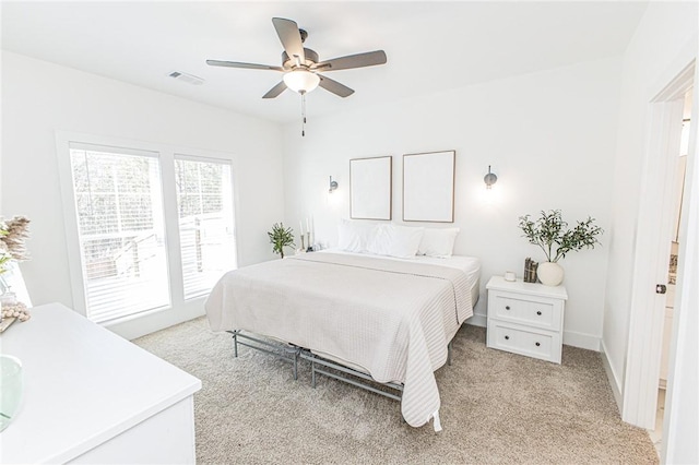 bedroom featuring ceiling fan and light colored carpet