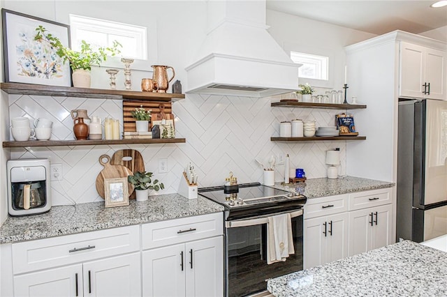 kitchen with white cabinets, stainless steel appliances, decorative backsplash, and custom exhaust hood