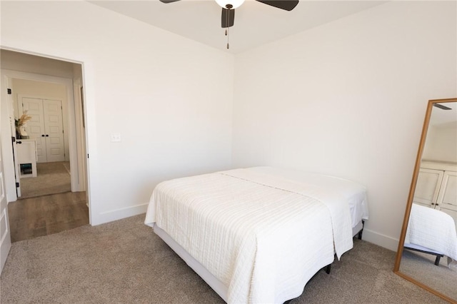 bedroom with ceiling fan and carpet floors