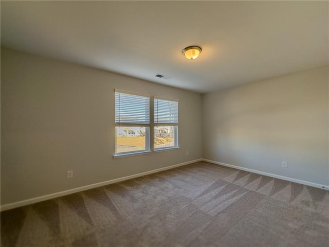 unfurnished room featuring carpet floors