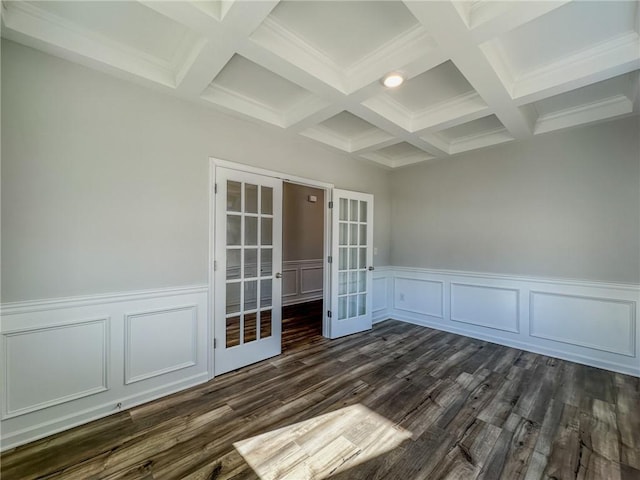 unfurnished room with coffered ceiling, dark hardwood / wood-style floors, beam ceiling, and french doors