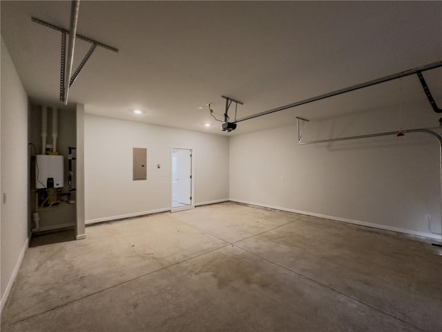 garage featuring water heater, a garage door opener, and electric panel