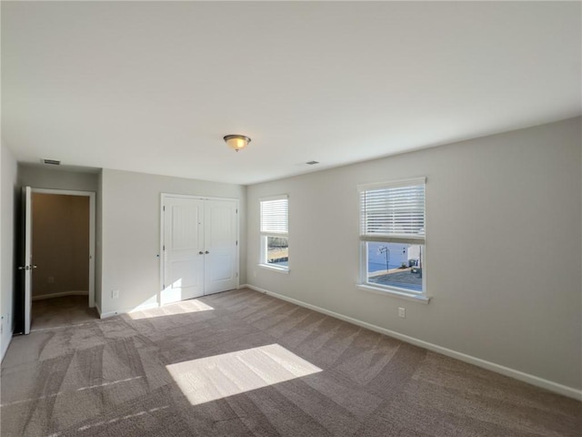 unfurnished bedroom with carpet