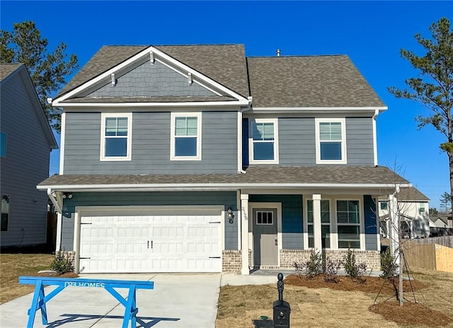 view of front of property with a garage and a porch