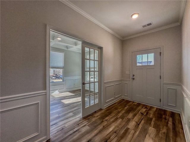 doorway featuring dark hardwood / wood-style flooring, ornamental molding, beamed ceiling, and coffered ceiling