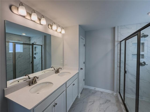 bathroom featuring an enclosed shower and vanity