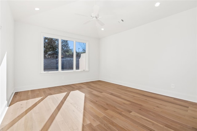 spare room with light hardwood / wood-style flooring and ceiling fan