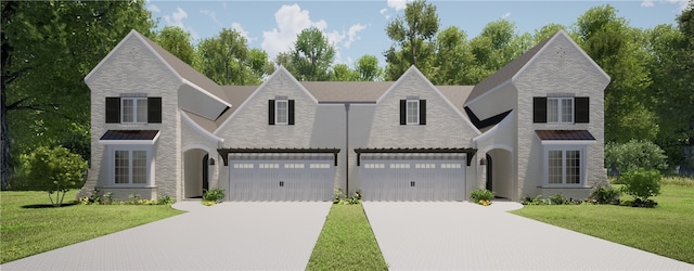 view of front facade featuring a front lawn and a garage