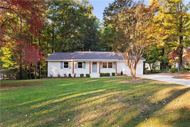 view of front of house with a front yard, a porch, and a garage