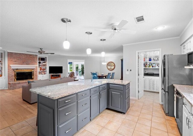 1340 Ferndale Dr, Auburn, AL 36830 - kitchen featuring a ceiling fan, gray cabinetry, ornamental molding, built in features, and stainless steel appliances