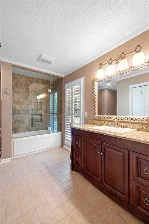 1340 Ferndale Dr, Auburn, AL 36830 - full bathroom with a textured ceiling, crown molding, vanity, enclosed tub / shower combo, and tile patterned flooring