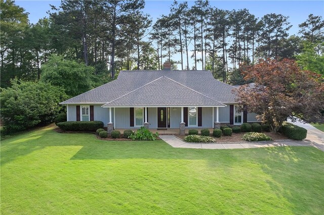1340 Ferndale Dr, Auburn, AL 36830 - view of front of home with a porch, a chimney, a front lawn, and a shingled roof
