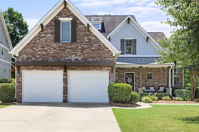 craftsman-style house with a garage and a front lawn