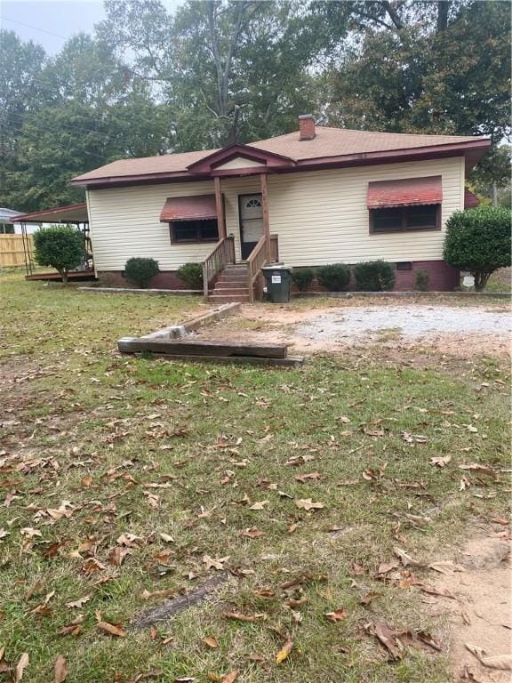 ranch-style house with a front lawn