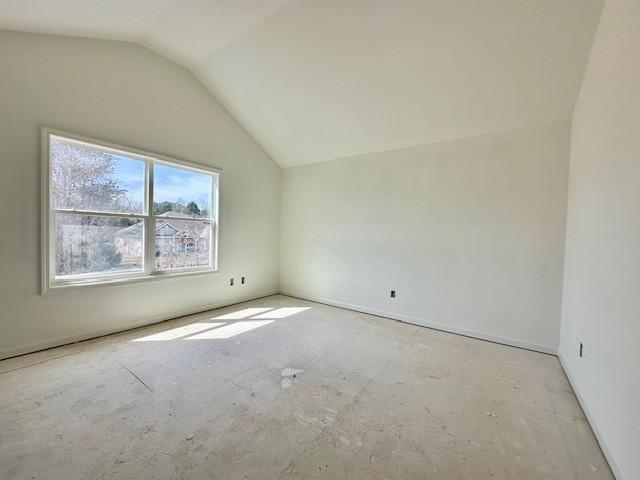 empty room with vaulted ceiling