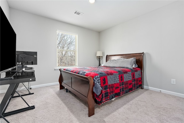 bedroom featuring carpet flooring, baseboards, and visible vents