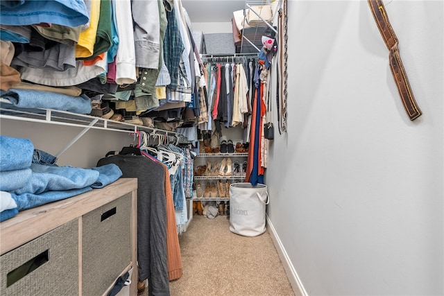 spacious closet with carpet floors