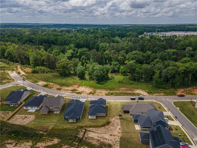 bird's eye view featuring a view of trees and a residential view