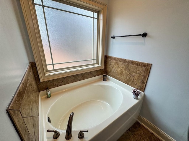 bathroom with a tub to relax in