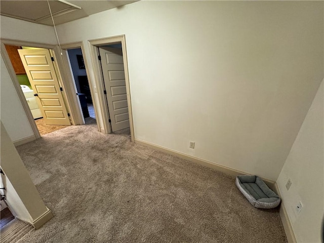 spare room featuring washer / dryer and carpet floors