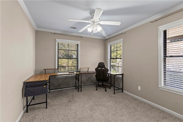 carpeted home office featuring ceiling fan and ornamental molding