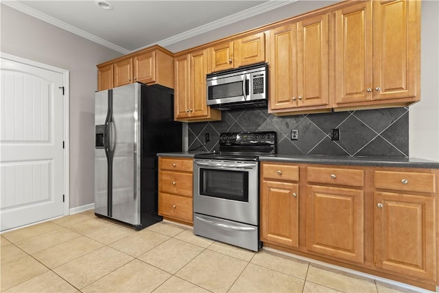 kitchen with light tile patterned flooring, ornamental molding, appliances with stainless steel finishes, and tasteful backsplash