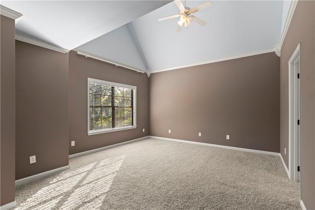 empty room with light carpet, crown molding, ceiling fan, and lofted ceiling