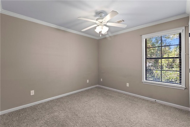 carpeted empty room featuring ceiling fan, crown molding, and a healthy amount of sunlight