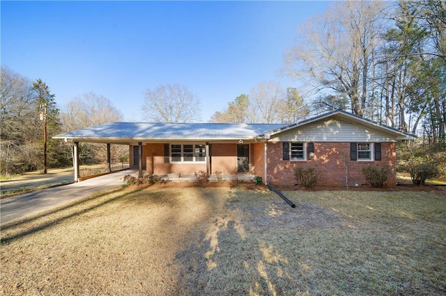 ranch-style home with driveway, an attached carport, and brick siding