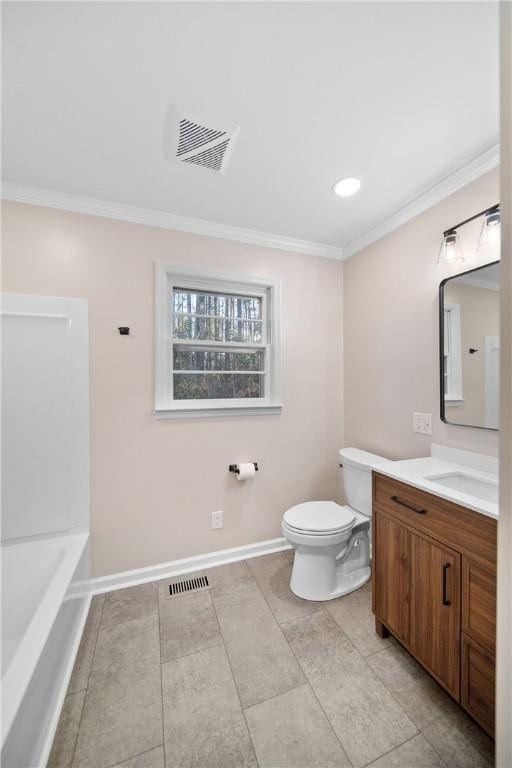 bathroom with toilet, vanity, visible vents, baseboards, and ornamental molding