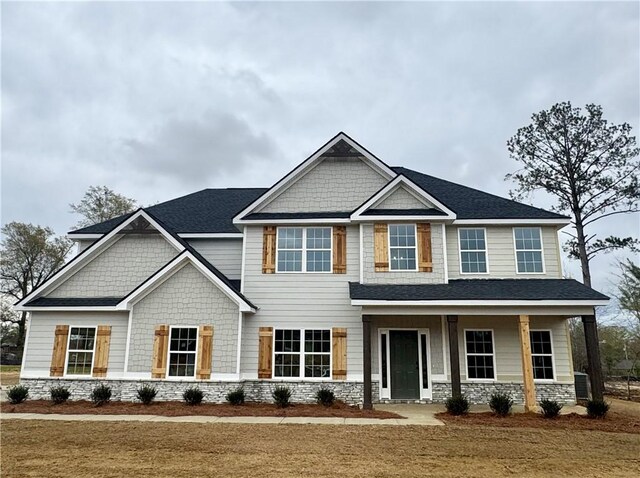 view of front of home featuring a porch and a front yard